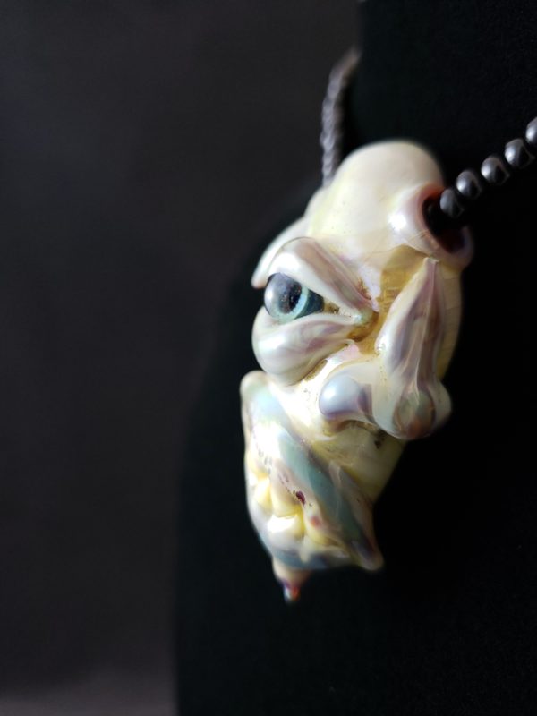 Glass Creature Face Pendant left side view