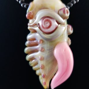 glass sea creature pendant with red and pink spiral eye