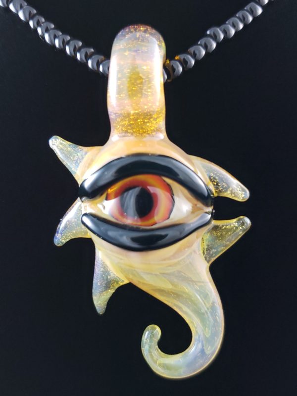 yellow red and orange eyed glass sea horse creature pendant