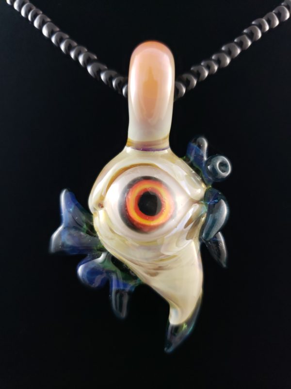 red yellow orange eye sea creature pendant with blue and green fins