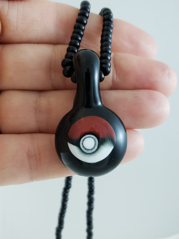 Glass Pokemon Ball Pendant hand